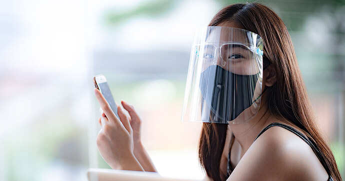 girl-with-face-shield-and-phone