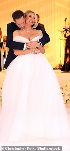 50410973-10193829-Three_Paris_slipped_into_another_wedding_gown_during_the_ceremon-a-233_1636775958067